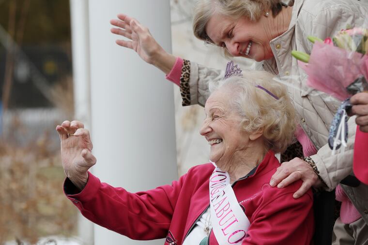 Mary Ellen May, known to all as "Baba," was celebrated in grand style Saturday -- and for good reason. She turned 100. A big parade of fans drove by the Wallingford home of daughter Judy Godick (holding the flowers) to offer birthday greetings. Joining them is daughter Sandy Kestner (top).