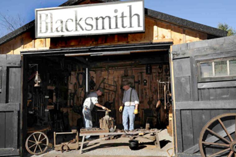 Brian Dunnigan (right) and son Keenan at Eckley Miners' Village near Freeland, Pa. Dunnigan moved out of his family home into one of the museum's old miner houses last year. (Clark Van Orden / Wilkes-Barre Times Leader)
