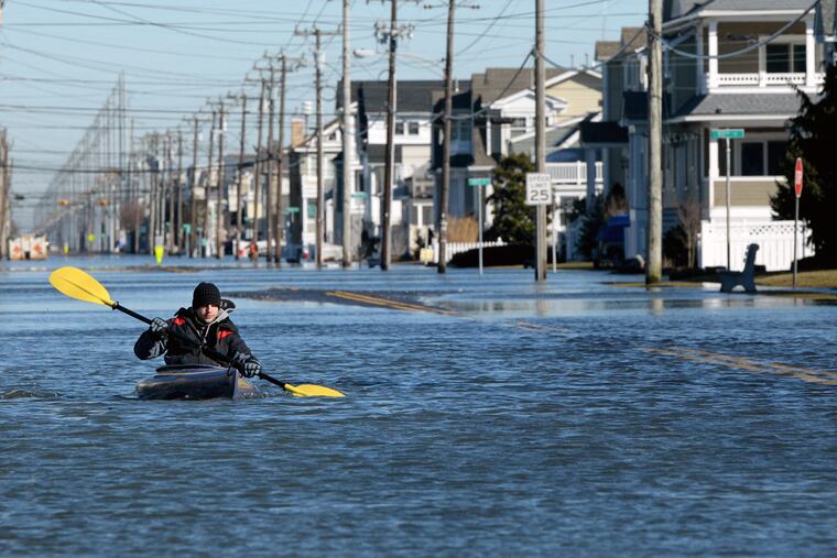 Max Sorensen kayaked along Third Avenue in Stone Harbor after last month’s storm. The storm caused more than $70 million in damage in Atlantic and Cape May Counties alone.