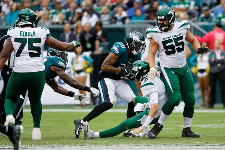 Philadelphia Eagles' Orlando Scandrick (38) strips the ball from New York Jets' Luke Falk (8) for an eventual touchdown during the second half of an NFL football game, Sunday, Oct. 6, 2019, in Philadelphia. (AP Photo/Matt Rourke)