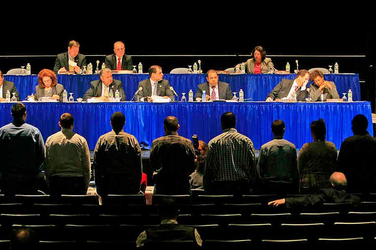 Patients at Damon House in New Brunswick stand in support of testimony by Debra Wentz of the N.J. Association of Mental Health and Addiction Agencies.