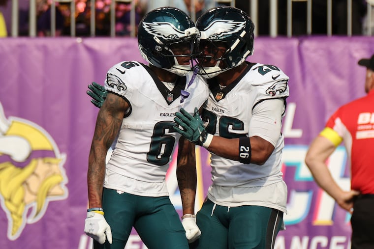 DeVonta Smith (6) celebrates with Saquon Barkley after Smith scored a touchdown on Oct. 19 at U.S. Bank Stadium.