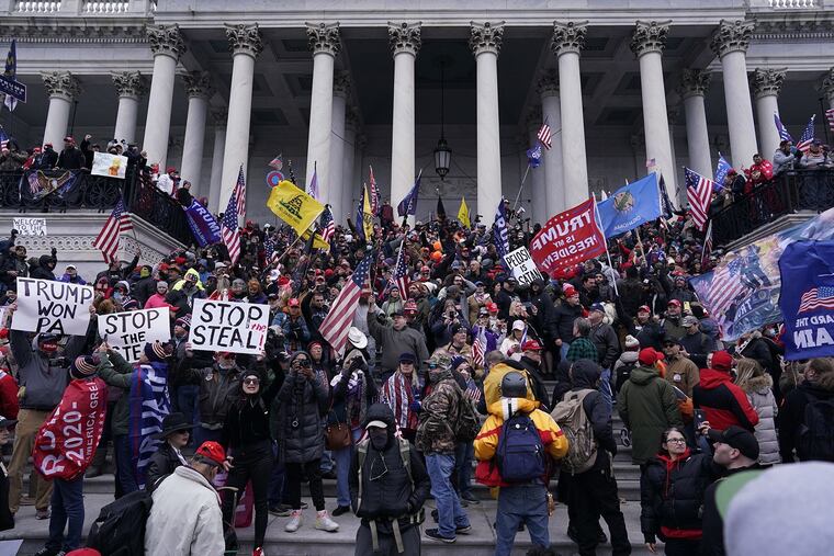Supporters of then-President Donald Trump swarm the U.S. Capitol Jan. 6, 2021, at his urging, based on his unfounded claims that the election was stolen. Members of the Oath Keepers are accused of taking part in the riot.