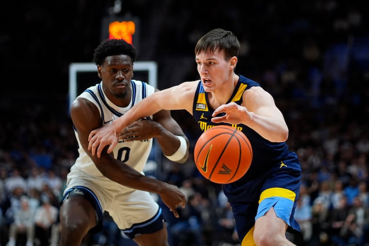Marquette's Tyler Kolek, right, tries to get past Villanova's TJ Bamba during the first half of their game last Tuesday.