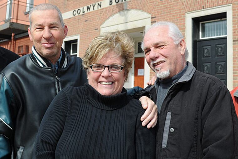 The new team running the Borough of Colwyn includes (from left): Paul Meuser, borough council president; Paula Brown, borough manager; and Dan Rutland, interim borough manager. Not pictured are Fred Lesher, councilman and chairman of the finance committe; and Jesse Brundage, councilman and chairman of the public safety committee. Photographed in front of Colwyn Borough Hall Feb. 25, 2014. ( CLEM MURRAY / Staff Photographer )