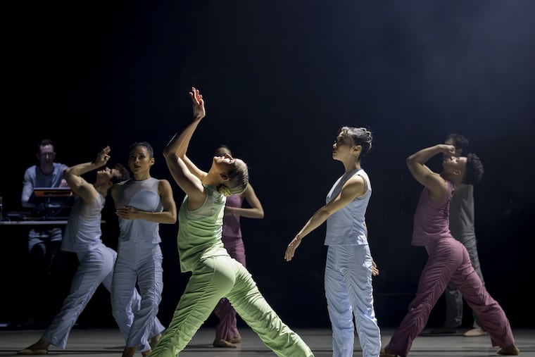BalletX dancer Skyler Lubin (center), with the company and composer Scott Ordway (left), who played live on stage in Matthew Neenan's "Squares."
