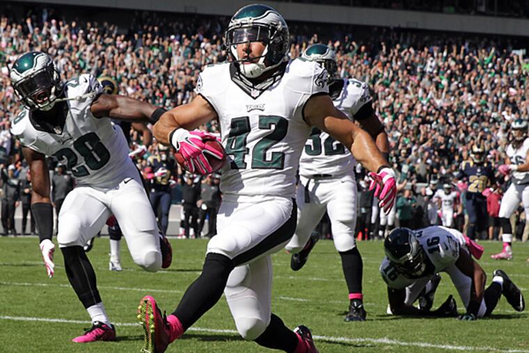 Eagles special teams player Chris Maragos scored a touchdown following a blocked punt against the Rams. (David Maialetti/Staff Photographer)