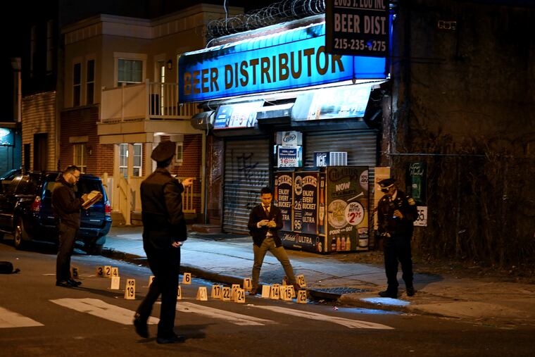 Investigators on the scene of a shooting at 31st and Norris Streets in Strawberry Mansion on Thursday.