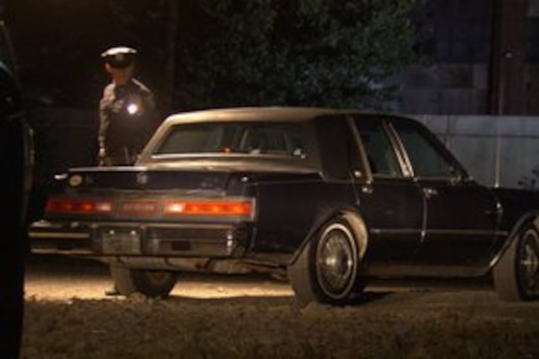 In a scene from "Philly Mob," police inspect the car where Anthony "Tony Bananas" Caponigro's corpse was found in the Bronx.