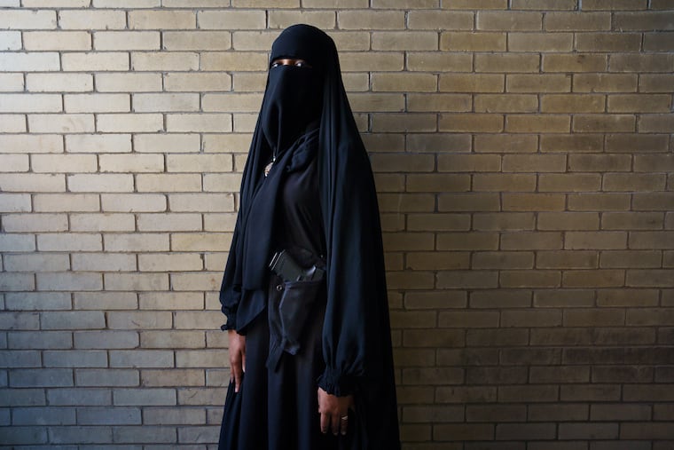 Myisha McGahee-Wooten is shown here near 8th and Filbert streets. McGahee-Wooten has a license to carry a firearm and an Instagram-based business called Muslimah Concealed Carry that encourages Muslim women to own guns to protect themselves.