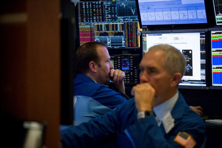 Traders work on the floor of the New York Stock Exchange on Monday, Nov. 12, 2018. U.S. stocks extended declines.