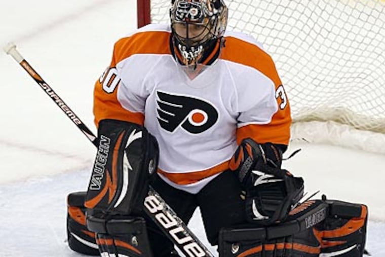 Ilya Bryzgalov allowed four goals against the Devils during Game 3 on Thursday. (Yong Kim/Staff Photographer)