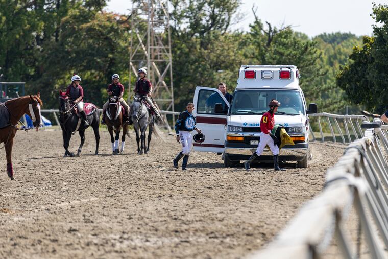 Jockeys exiting an ambulance after an incident from a race on the dirt track at the 2024 Pennsylvania Derby at Parx Racing in Bensalem on Sept. 21.