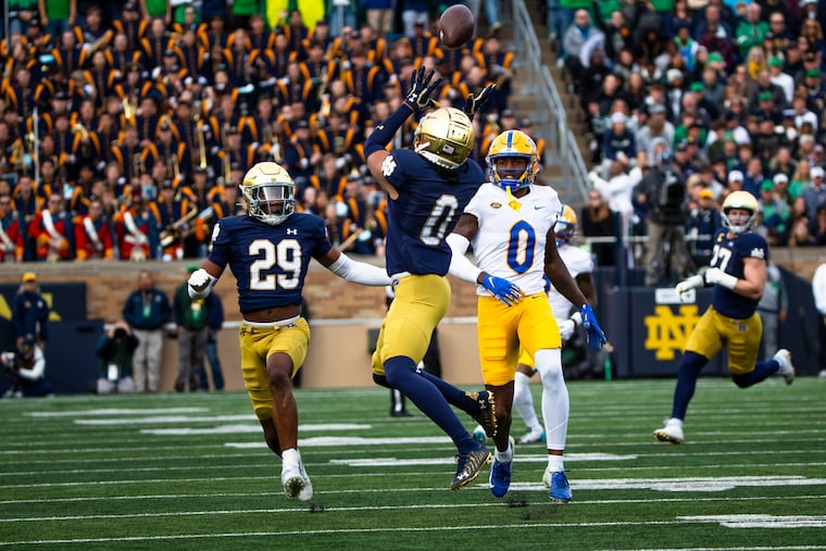 Notre Dame safety Xavier Watts intercepting a pass against Pittsburgh on Oct. 28, 2023. Watts could fill a need for the Eagles in the second round of the draft.