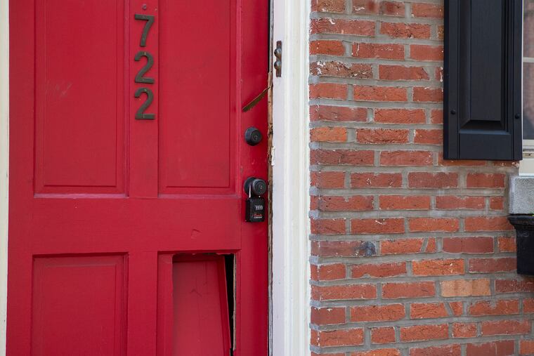 The doorway at 722 Lombard St., where firefighters responding to a report of smoke found the burned body of a 58-year-old woman in her apartment.