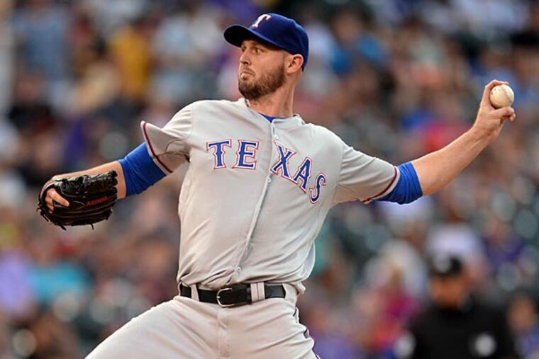 Texas Rangers starting pitcher Matt Harrison (54) delivers pitch in the first inning against the Colorado Rockies at Coors Field. (Ron Chenoy/USA Today)
