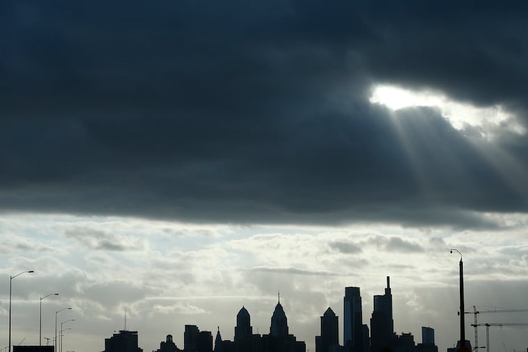 Light pokes through clouds over Center City in the fall. We've seen a lot of those lately, along with fall-like temperatures.