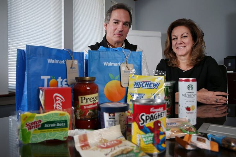 Doug Guyer, BrandShare president and CEO, and his sister Kathie Tuoni, chief operating officer, in the product-sampling company’s Berwyn headquarters with items included in tote bags being offered to first-time Walmart online grocery customers.