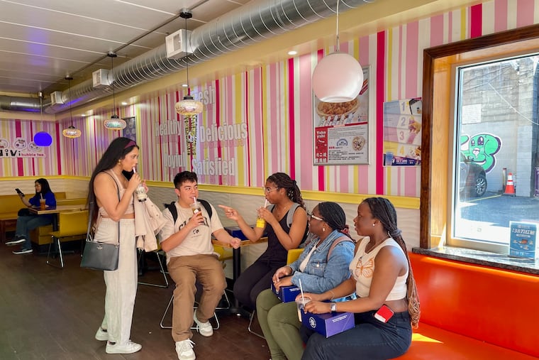 Matthew Rodriguez and friends sit at Vivi Bubble Tea in Chinatown.