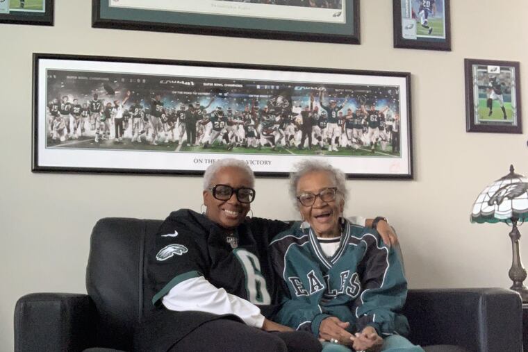 Danita Alston, at left, and her mother, Marybelle, sport their best Eagles gear at home in Riverview, Fla.