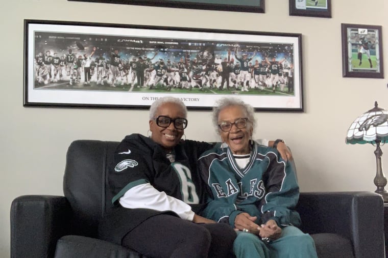 Danita Alston, at left, and her mother, Marybelle, at right, sport their best Eagles gear at home in Riverview, Fla.