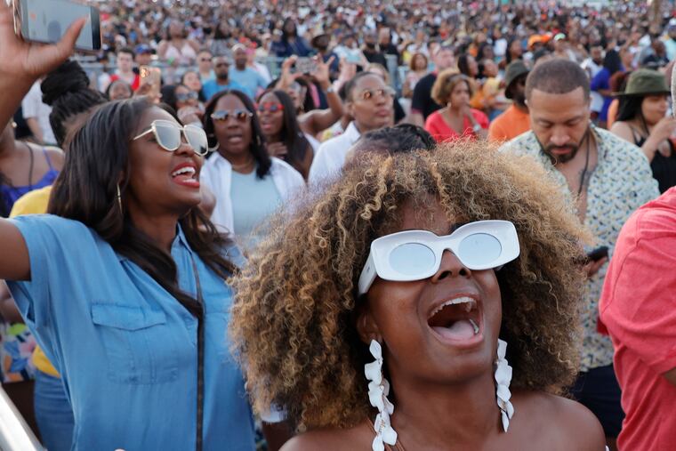 Dixie James of Manayunk (left) and Nikki Jacks of Prosper, Texas (front) sing to SWV during day two of the Roots Picnic Philadelphia at The Mann at Fairmount Park in Phila., Pa. on June 5, 2022.