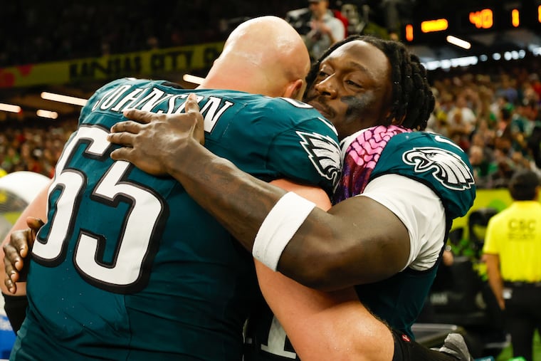 Eagles wide receiver A.J. Brown and offensive tackle Lane Johnson celebrate a Super Bowl LIX win against the Chiefs Sunday, Feb. 9, 2025, in New Orleans. Eagles win 40-22.