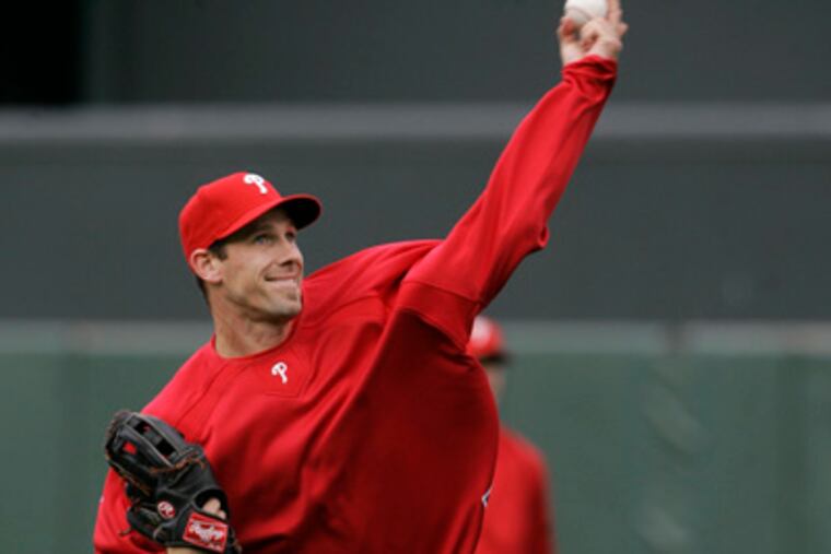 Cliff Lee warms up during batting practice before a baseball game against the Giants in San Francisco on July 30. (AP Photo / Jeff Chiu)