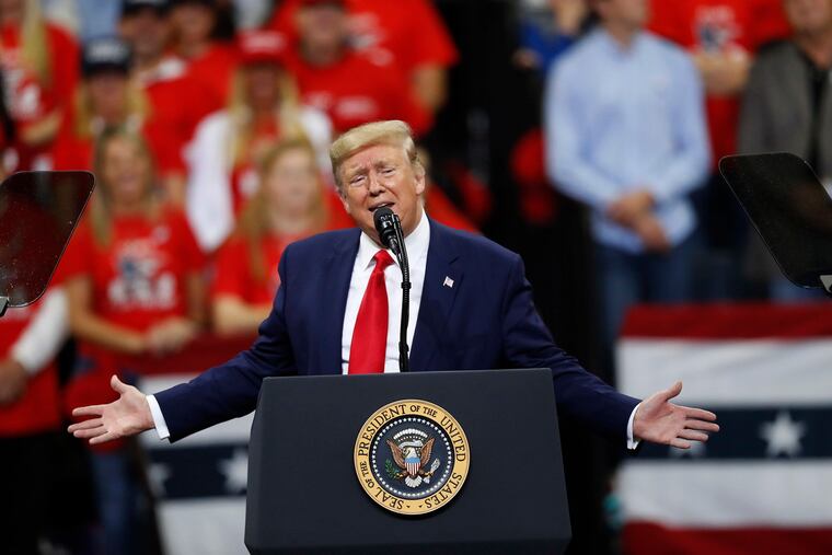 President Donald Trump addresses supporters during a campaign rally at the Target Center in Minneapolis on Thursday, Oct. 10, 2019.