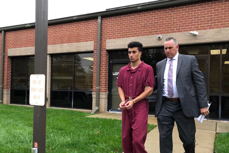 Mason Hall, 19, accused of raping a woman in a park, is led from District Court in Norristown by West Norriton Police Detective Mark D. Wassmer after a preliminary hearing Wednesday, Oct. 30, 2019.