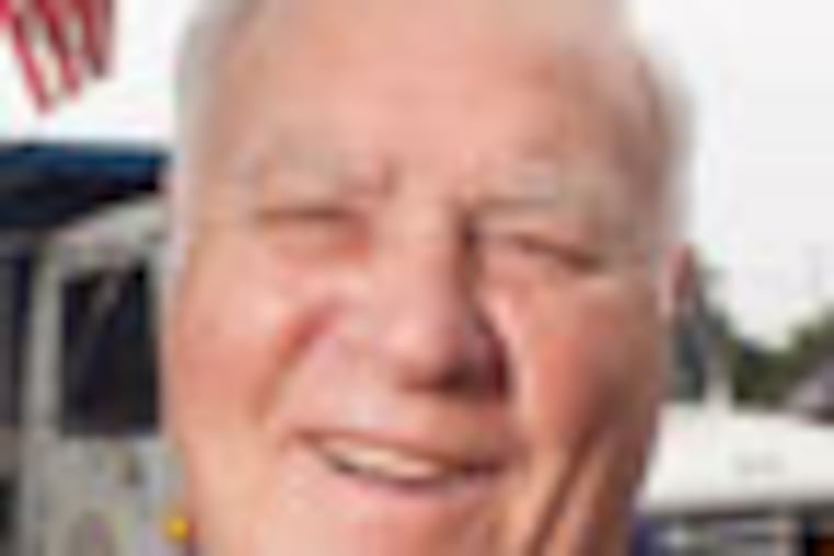 Collingdale Mayor Frank Kelly, 77, recently recognized by the state legislature as the longest serving mayor in Pennsylvania with 42 years of service. Seen here with a township municipal crew on Macdade Blvd. ( ED HILLE / Staff Photographer )
