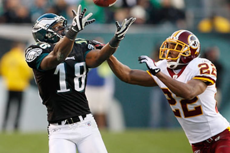 The biggest play on the Eagles' winning drive was a deep sideline pass thrown perfectly to Jeremy Maclin (left), who had gotten behind the press coverage of cornerback Carlos Rogers. (Ron Cortes/Staff Photographer)
