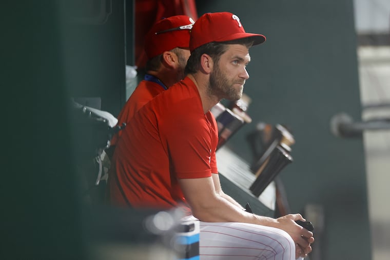 Bryce Harper is focused on regaining his swing more than his throwing arm as he works his way back from injury.