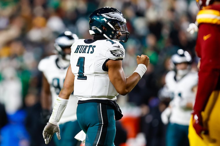 Jalen Hurts and the Eagles celebrated a 'hat and t-shirt' game after wrapping up the NFC East on Saturday.