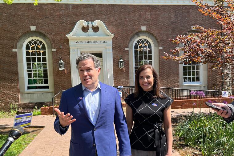 David McCormick and wife Dina Powell McCormick outside their polling place in Pittsburgh on May 17, 2022.