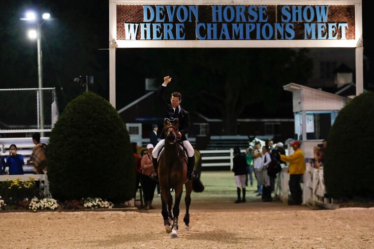 McLain Ward pumps his fist with HH Azur after winning the jump-off in the Sapphire Grand Prix of Devon at the Devon Horse Show and County Fair in Devon, Pa on Thursday, May 30, 2019.