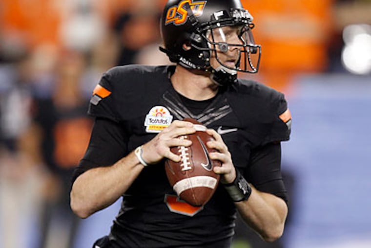 Oklahoma State's Brandon Weeden could be available to the Eagles in a later round of the draft. (Paul Connors/AP file photo)