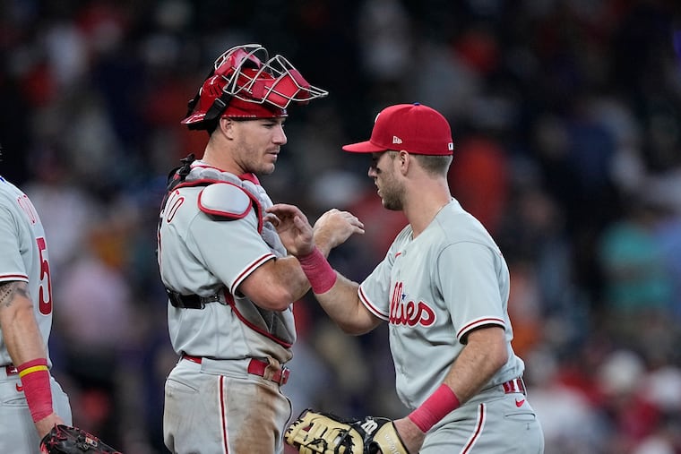 J.T. Realmuto, left, and Kody Clemens celebrates after the Phillies' 6-1 win over the Houston Astros on Saturday.