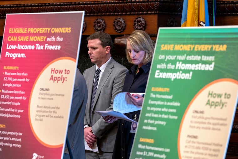 James Aros, Jr. (left), Chief Assessment Officer at the Office of Property Assessment, and Revenue Commissioner Kathleen McColgan (right) attend a Mayor Cherelle L. Parker press conference at City Hall on Monday Aug. 5, 2024.