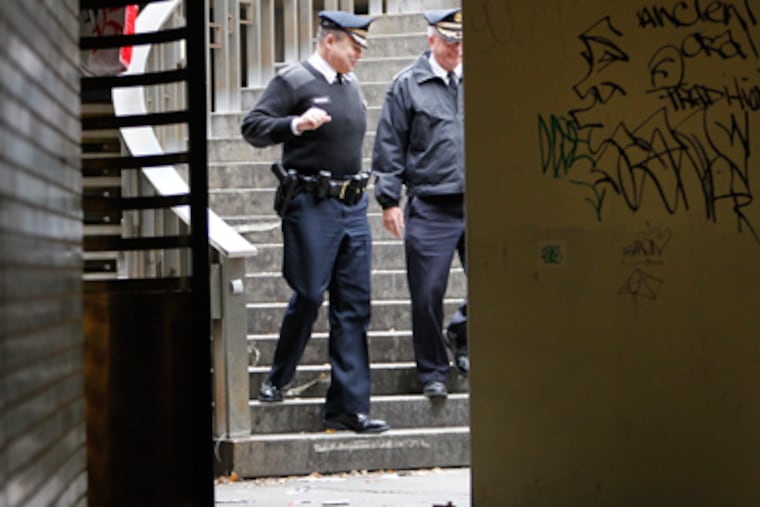 Philadelphia police underneath Dilworth Plaza where police found excrement and graffiti covering walls along the tunnels below the Occupy Philadelphia encampment on Tuesday morning November 15, 2011. ( Alejandro A. Alvarez / Staff Photographer )