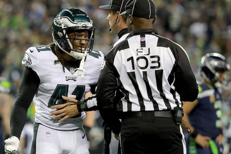 Eagles’ Ronald Darby, left, argues a call as the Philadelphia Eagles play the Seattle Seahawks in Seattle, WA on December 3, 2017. Eagles lost 24-10. DAVID MAIALETTI / Staff Photographer