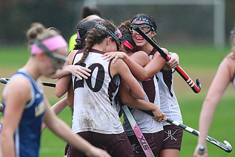 Holy Cross celebrates a goal by Mia Scott. (David Swanson/Staff Photographer)