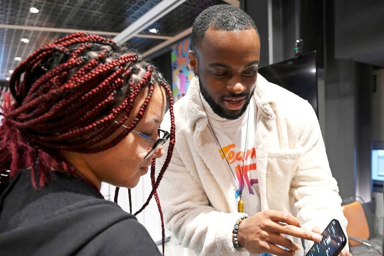 Student from George Washington High School participates in an interactive session during a career presentation as part of their career day visit to the Comcast Technology center