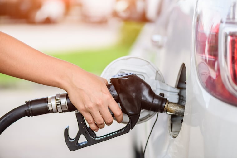 If you keep pumping gas once the nozzle clicks off, you may be forcing liquid into the car's carbon pollution canister. That can cause problems. (Dreamstime / TNS)