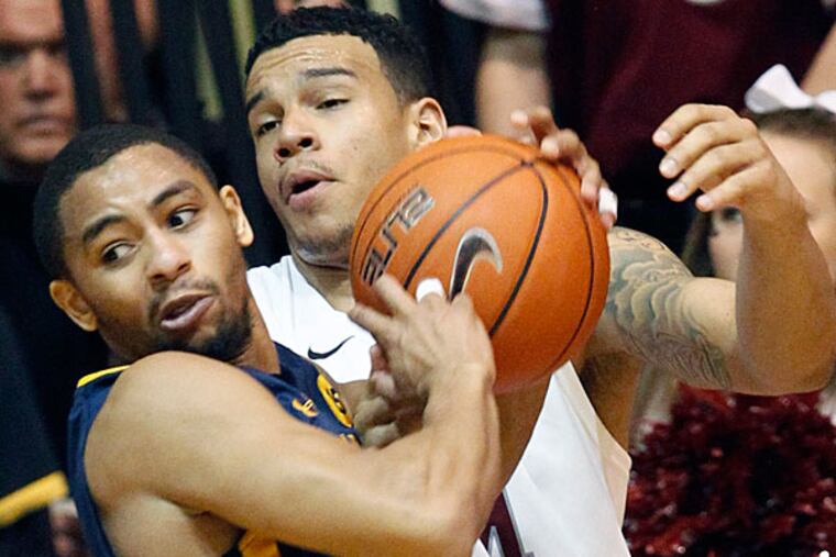 St. Joe's Chris Wilson fouls La Salle's Tyreek Duren. (Ron Cortes/Staff Photographer)