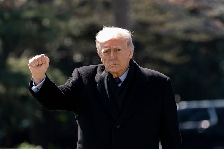 President Donald Trump pumps his fist as he walks to depart on Marine One from the South Lawn of the White House, Wednesday, March 18, 2026, in Washington. (AP Photo/Alex Brandon)