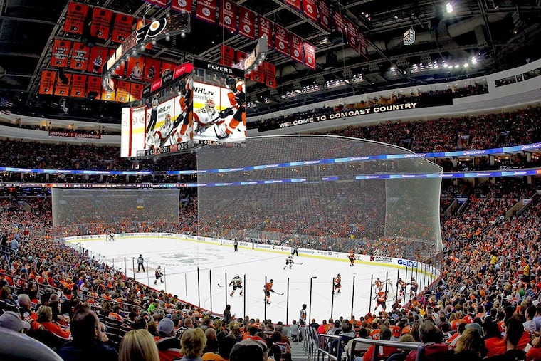 Sports fans and others at the Wells Fargo Center can watch replays and other video on a new huge scoreboard as part of the arena's $250 million renovation.