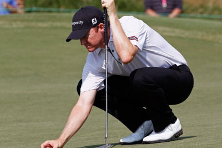 Jimmy Walker shot an 8-under 62 on Friday to take the lead at 12-under 128 after two rounds. (Gerry Broome/AP)