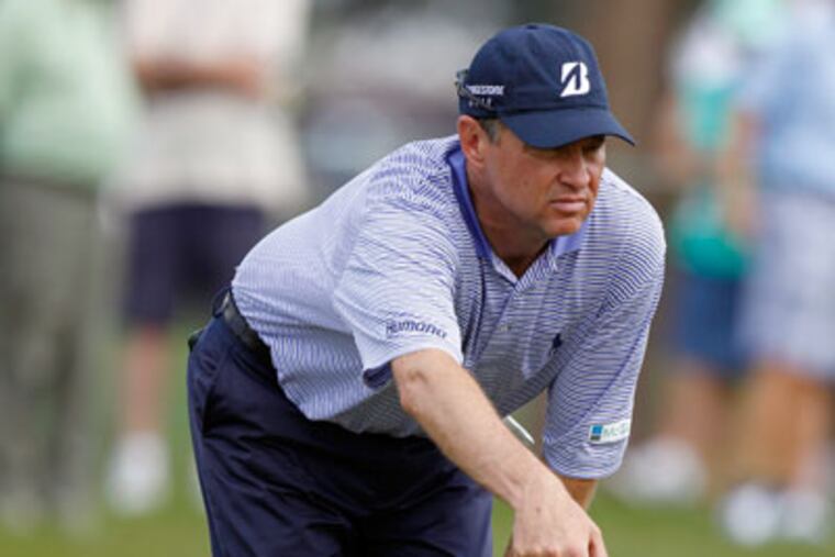 Davis Love III lines up a putt on the tenth green during the first round of the Honda Classic. (Lynne Sladky/AP)