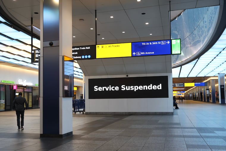 Service suspended signs are posted inside Penn Station on the first day of a Long Island Rail Road strike, Saturday, May 16, 2026, in New York.